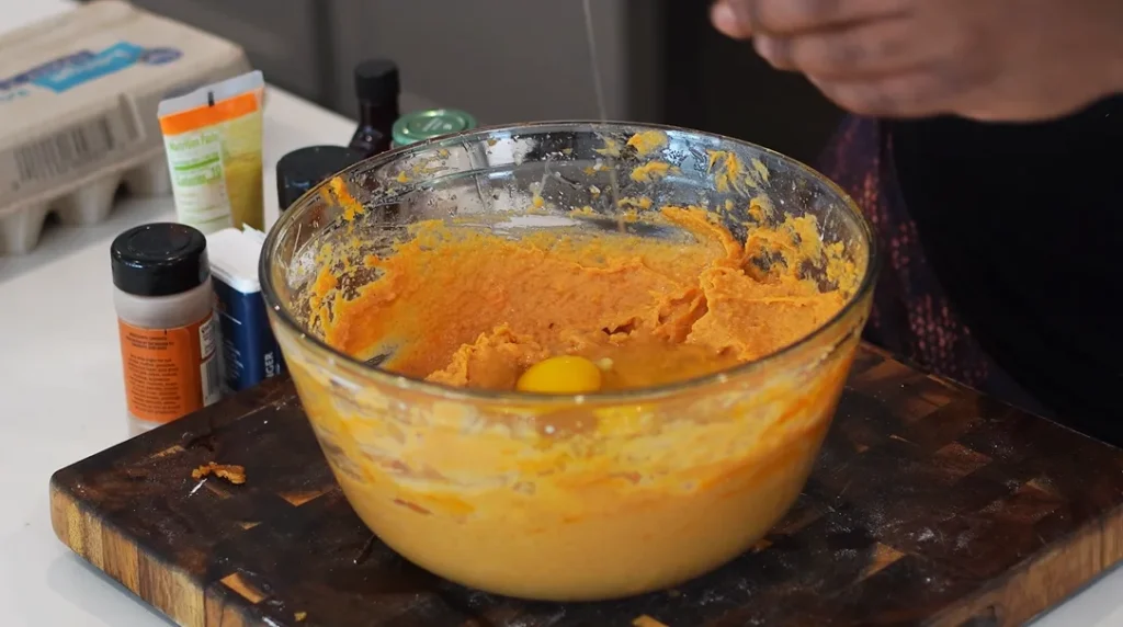 Add the browned butter, maple syrup, brown sugar, cinnamon, nutmeg, ginger, salt, vanilla extract, evaporated milk, eggs, and flour. Whisk until the filling is smooth and well combined.