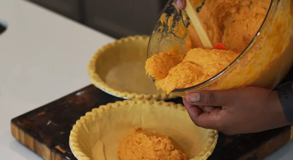 Pour the filling into the prepared 9-inch deep-dish pie crust and smooth the top with a spatula.