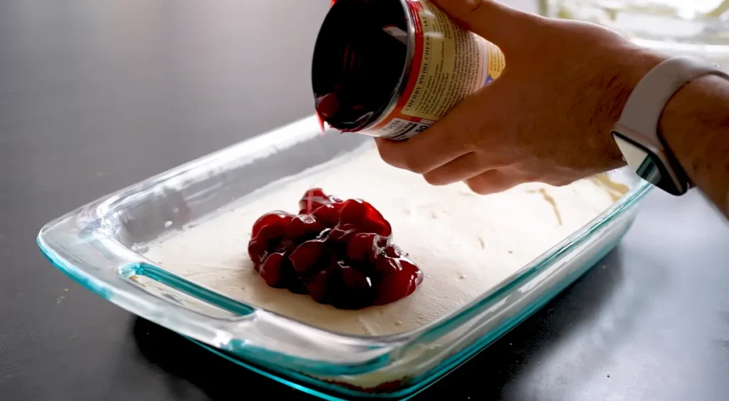 Cherry pie filling added over the creamy layer of Cherry Yum Yum