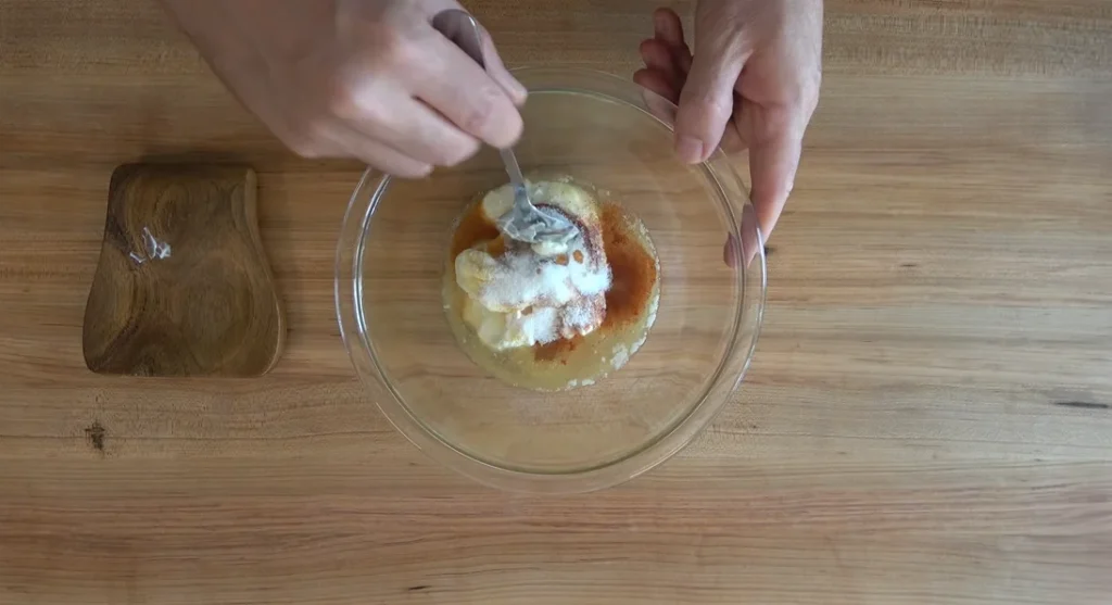 Gradually whisk in the mayonnaise mixture, followed by the prepared seasoning blend, stirring continuously until the sauce becomes smooth and uniform in color.