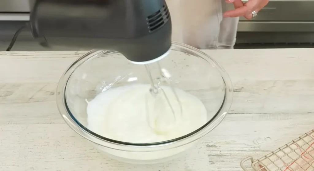 Homemade whipped cream prepared for serving with pumpkin pie