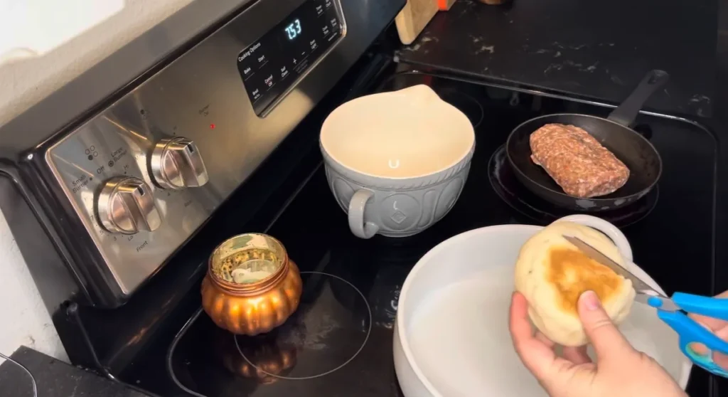 Cutting toasted English muffins into cubes for Eggs Benedict Casserole
