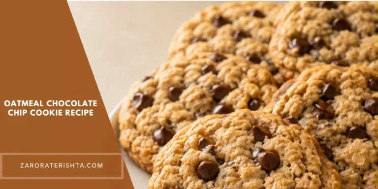 A plate of freshly baked oatmeal chocolate chip cookies with one golden-brown cookie in the foreground and several cookies arranged behind it on a warm neutral kitchen surface.