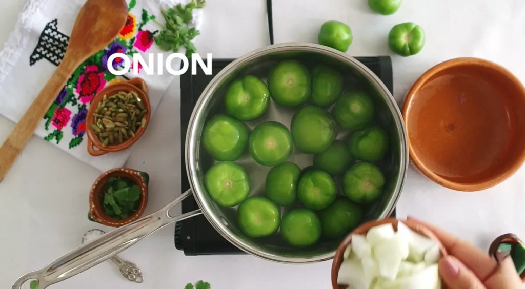 Fresh tomatillos with onion and cilantro prepared for Pozole Verde