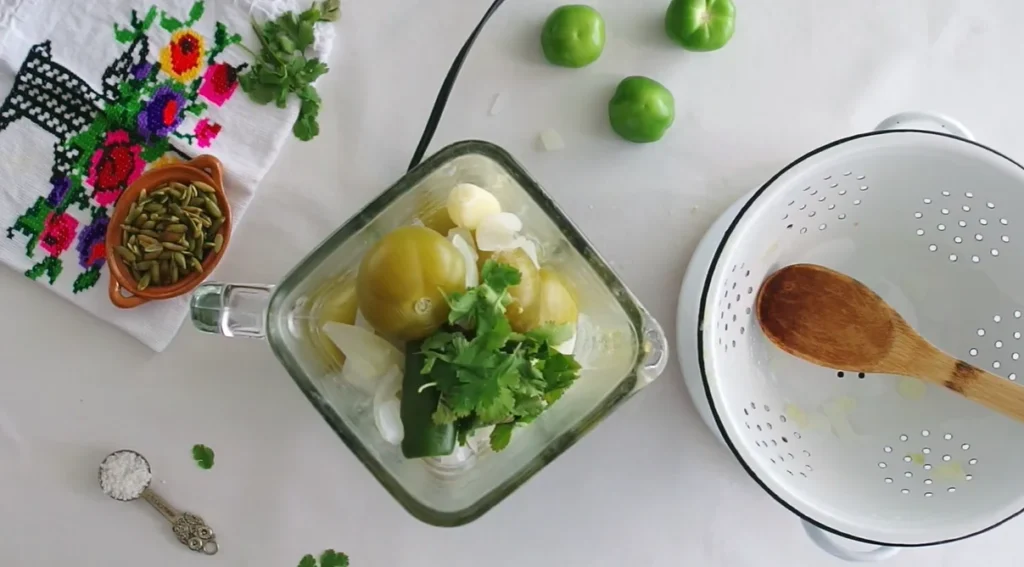Cooked tomatillos, onion, peppers, garlic, and cilantro ready for blending