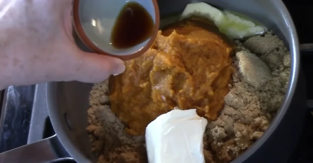 Pumpkin caramel sauce ingredients combined in a saucepan for pumpkin spice monkey bread