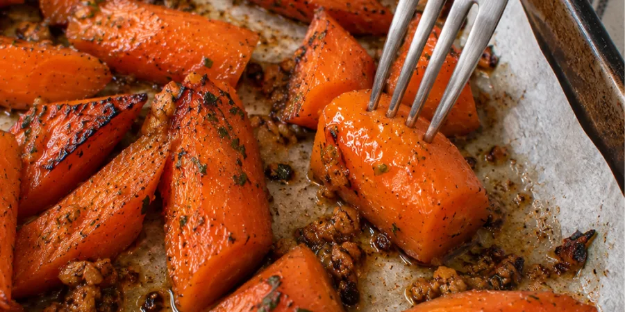 Fork test to check if roasted carrots are tender