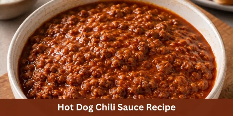 Finished hot dog chili sauce in a serving dish shown at a 45-degree angle, presented as the main subject in a clean food setting with restrained hot dog context.