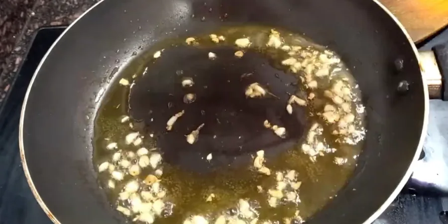 Melting butter and garlic in a saucepan for honey garlic glaze