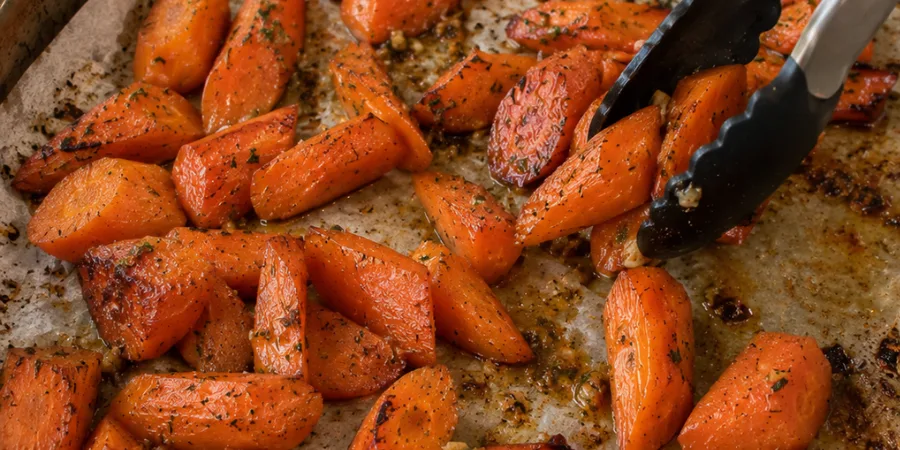 Tossing partially roasted carrots halfway through roasting