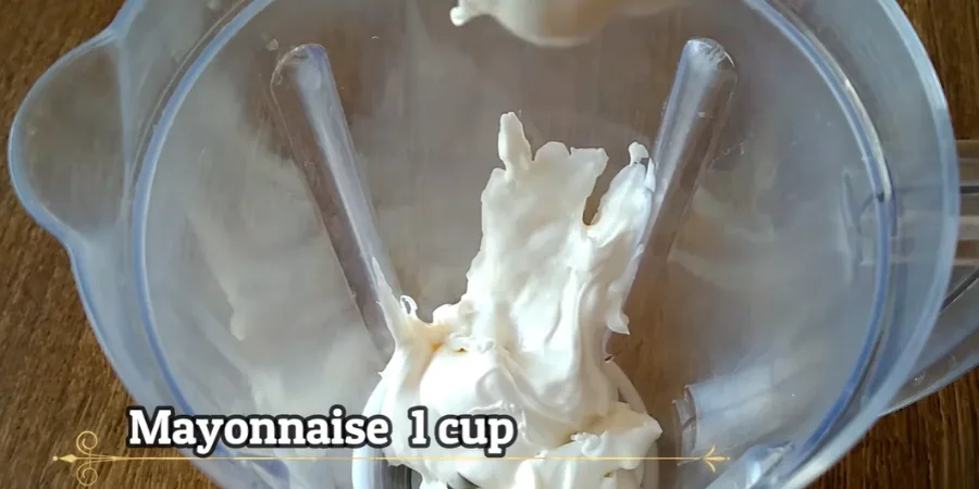 Mayonnaise in a blender jar used as the creamy base for shawarma sauce
